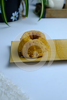 Malaysian dessert dish steamed caramelised sweet and soft cake or apam gula on white background
