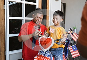 Malaysian family on malaysia independence day with basikal hias