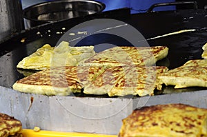 Malaysian street food called Murtabak. Cook by street hawkers. photo