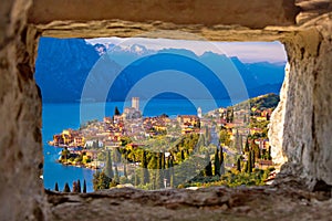 Malcesine and Lago di Garda aerial view through stone window