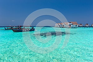 Maldive water villa and blue sea