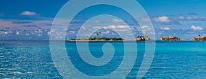 Maldives beach lagoon panorama under the blue sky