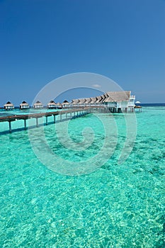 Maldives bungalows on the blue sea