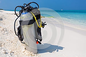 Maldives island beach, scuba diving gear on a beach