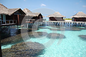 Maldives paradise coral water bungalow luxury photo