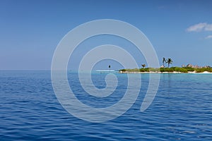 Maldives. Tropical island, ocean and clear blue sky