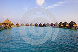 Maldives. Villa on piles on water at the time su