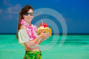 Maldives, women with coconut