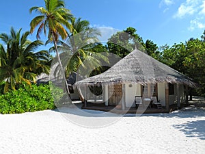 Maldivian beach bungalow photo