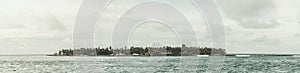 Maldivian islet on a cloudy day