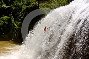 Male abseils massive waterfall photo