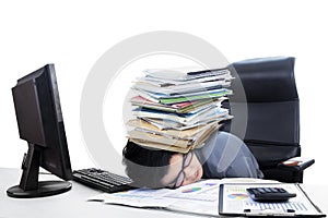 Male accountant with stack of paperwork