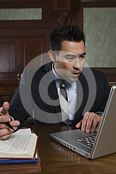 Male Advocate Using Laptop