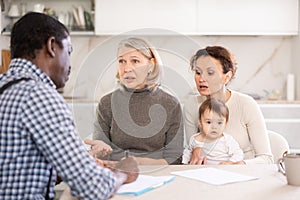 Male agent offers good insurance conditions for family of different generation