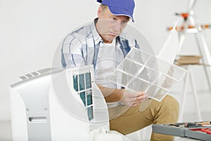 male air conditioning technician at work