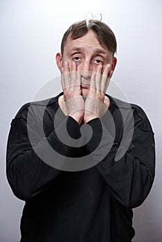 Male alcoholic and drug addict of a sickly appearance on a white background