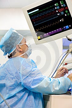 Male anaesthesiologist wih monitor photo