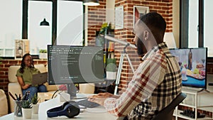 Male app developer using html script code on computer