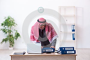 Male arab bookkeeper extremely tired with an excessive work