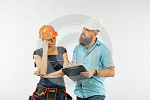 A male architect or engineer meeting with a building woman contractor on white background