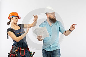 A male architect or engineer meeting with a building woman contractor on white background