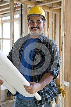 Male Architect Holding Unrolled Blueprint