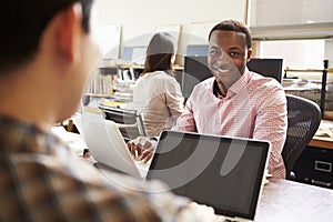 Male Architect Working At Desk On Laptop