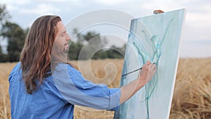 Male artist painting woman on canvas while standing in field