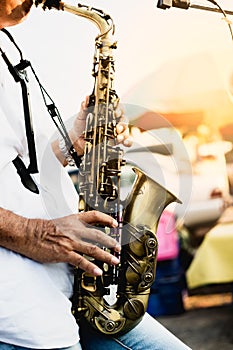 male artist playing saxophone