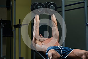 Male Athlete Doing Heavy Weight Exercise For Chest