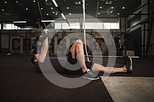 Male cross fit athlete working out at the gym photo
