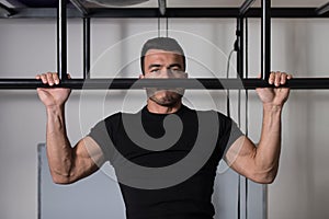 Male Athlete Doing Typewriter Pull Ups