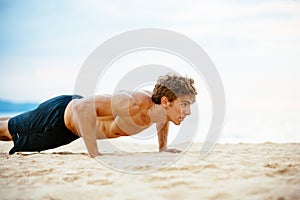 Male Athlete Exercising Doing Push-Ups