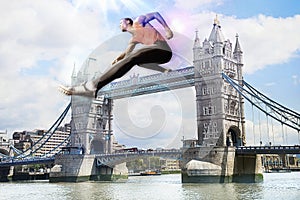 Male Athlete hurdling Tower Bridge