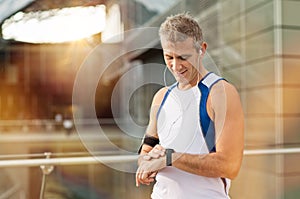 Male Athlete Looking At Watch