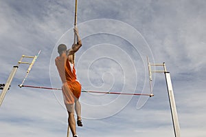 Male Athlete Performing A Pole Vault