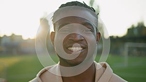 Male athlete portrait cheerful smiling ethnic young sportsman African American man athletic fit guy footballer runner