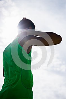 Male athlete preparing to throw shot put ball