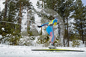 male athlete skier running cross country skiing in skating style