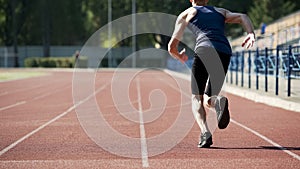 Male athlete starting to run, training his body and stamina, active way of life