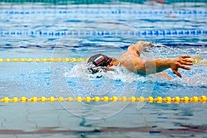 male athlete swim butterfly race in swimming competition