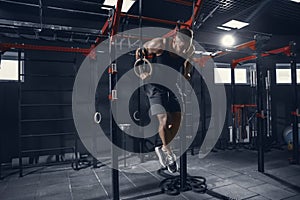 The male athlete training hard in the gym. Fitness and healthy life concept.