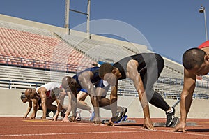 Male Athletes At Starting Blocks