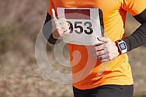 Male athletic runner on a cross country race. Outdoor circuit