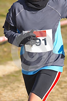 Male athletic runner on a cross country race. Outdoor circuit