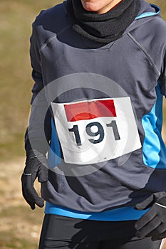 Male athletic runner on a cross country race. Outdoor circuit