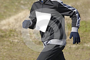 Male athletic runner on a cross country race. Outdoor circuit