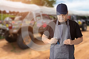 Male Auto mechanic hand holding wrench