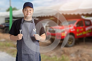 Male Auto mechanic hand holding wrench