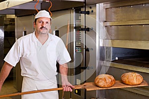 Male baker baking bread